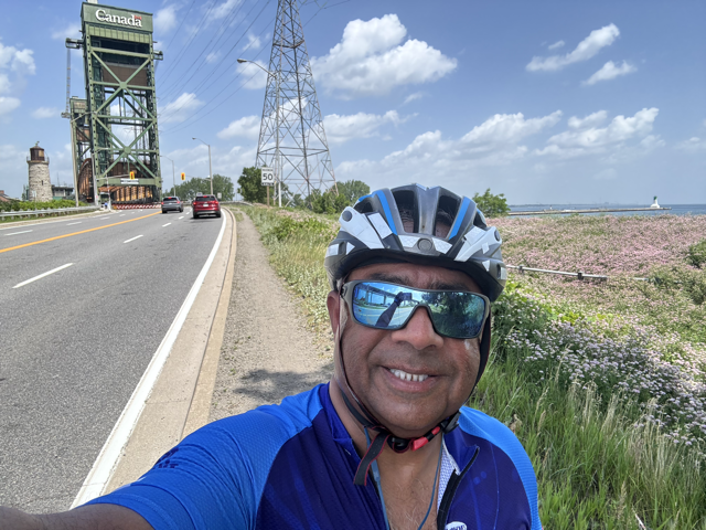 Cyclist beside the Canada lift bridge on the Burlington canal