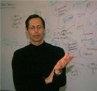 Robert Garigue teaching at a whiteboard